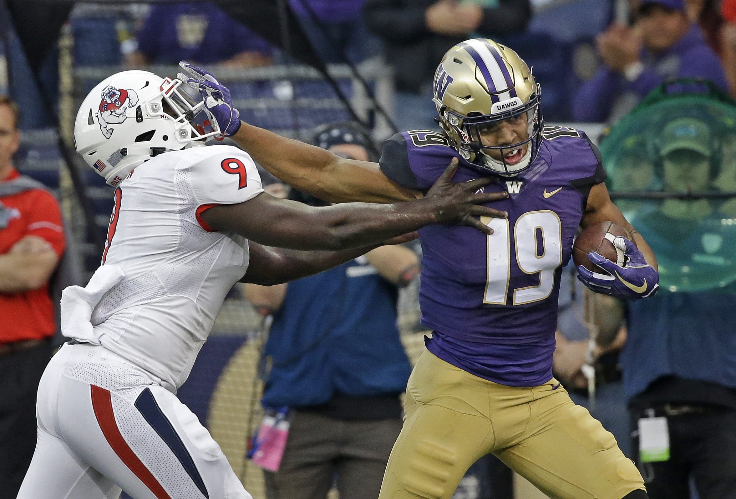 After spending more than half the season recovering from knee surgery in June, Washington’s Hunter Bryant (19) has provided a boost for the 10th-ranked Huskies’ offense this season.