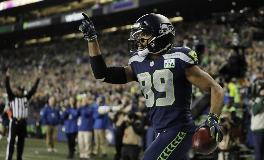 Seattle Seahawks wide receiver Doug Baldwin celebrates after catching a pass for a touchdown against the Green Bay Packers during the first half of an NFL football game Thursday, Nov. 15, 2018, in Seattle.