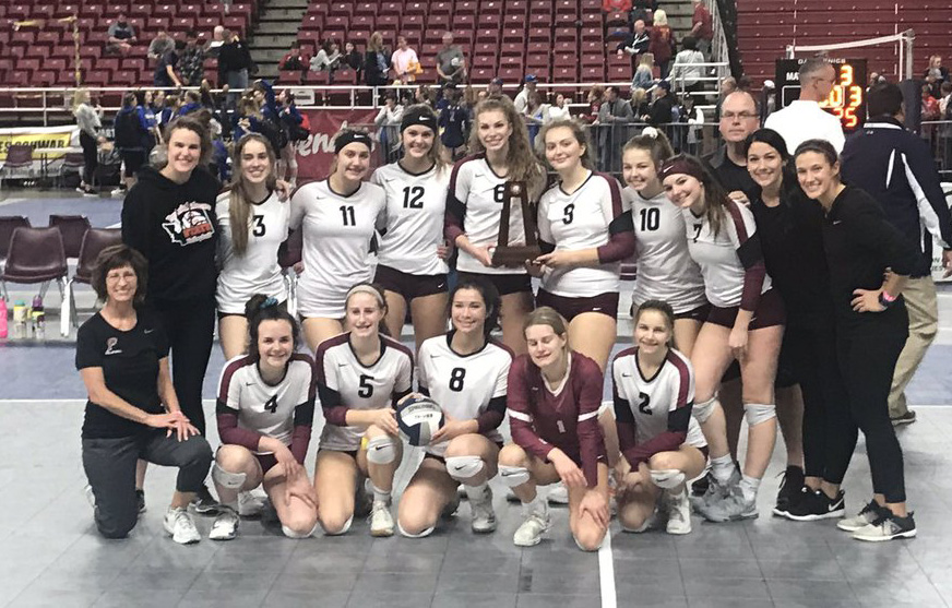 The Prairie High School volleyball team poses with the sixth-place trophy from the WIAA 3A state tournament at the Yakima SunDome on Saturday, Nov.