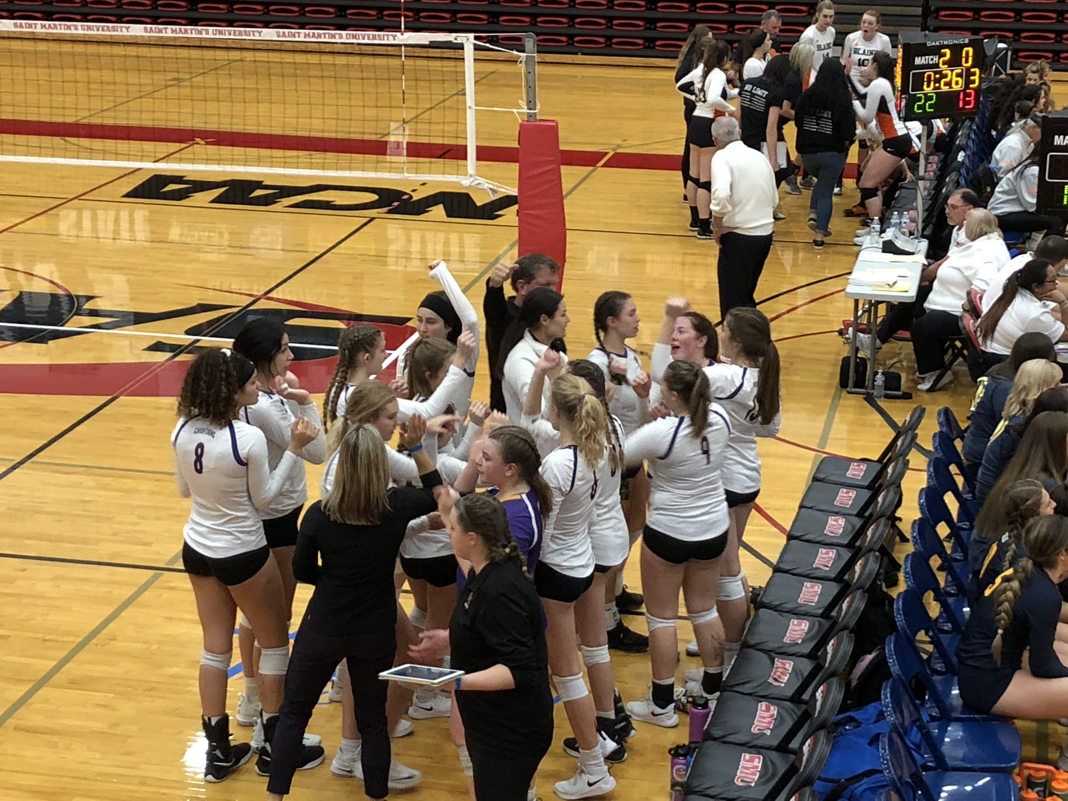 The Columbia River volleyball team huddles during its 2A state quarterfinal match against Blaine on Friday at Saint Martin's University in Lacey.