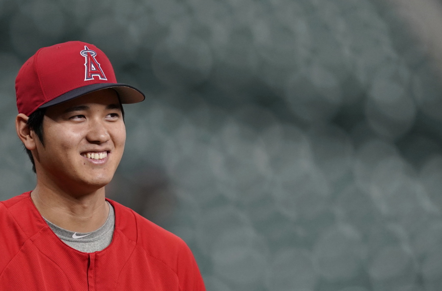 Los Angeles Angels’ Shohei Ohtani, of Japan, was voted American League Rookie of the Year after becoming the first player since Babe Ruth with 10 homers and four pitching wins in the same season. Ohtani, 24, received 25 first-place votes and four seconds for 137 points from the Baseball Writers’ Association of America in balloting announced Monday, Nov. 12, 2018. (AP Photo/David J.