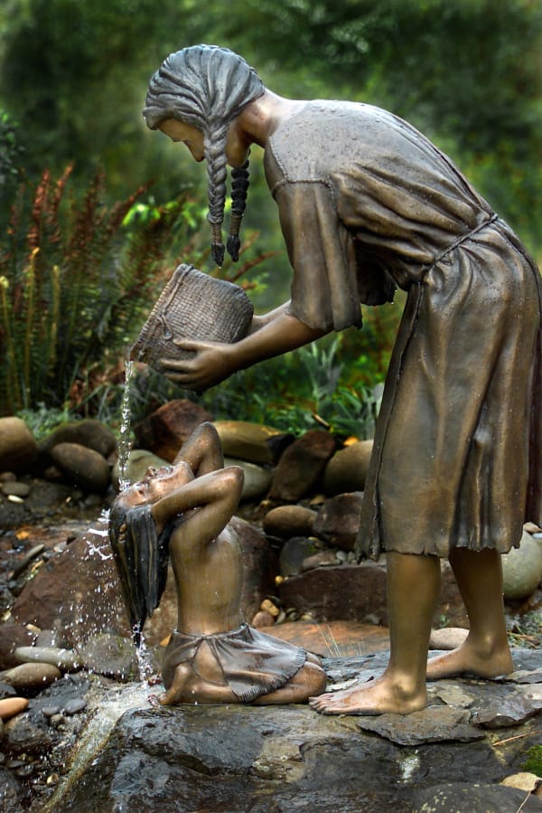 “Woman Bathing Child” by sculptor Jim Demetro as seen in 2001. Recently, residents noticed the mother depicted in the statue is missing. They fear it was stolen.