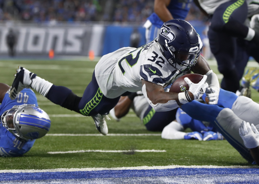 Seahawks running back Chris Carson (32) could miss Sunday’s game against the Rams with a hip injury.