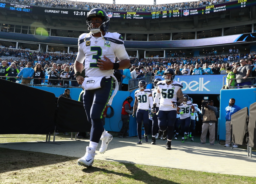 Seattle Seahawks’ Russell Wilson (3) leads his team onto the field before an NFL football game against the Carolina Panthers in Charlotte, N.C., Sunday, Nov. 25, 2018. (AP Photo/Jason E.
