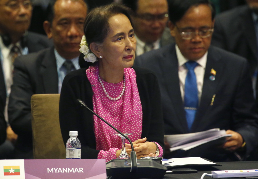 Myanmar leader Aung San Suu Kyi listens to speeches Wednesday at the ASEAN Plus China Summit in Singapore.