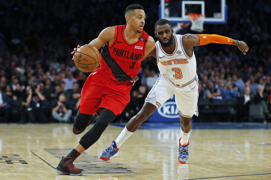 Portland Trail Blazers guard CJ McCollum (3) drives to the basket past New York Knicks guard Tim Hardaway Jr. (3) during the second half of an NBA basketball game Tuesday, Nov. 20, 2018, in New York. The Trail Blazers defeated the Knicks 118-114.