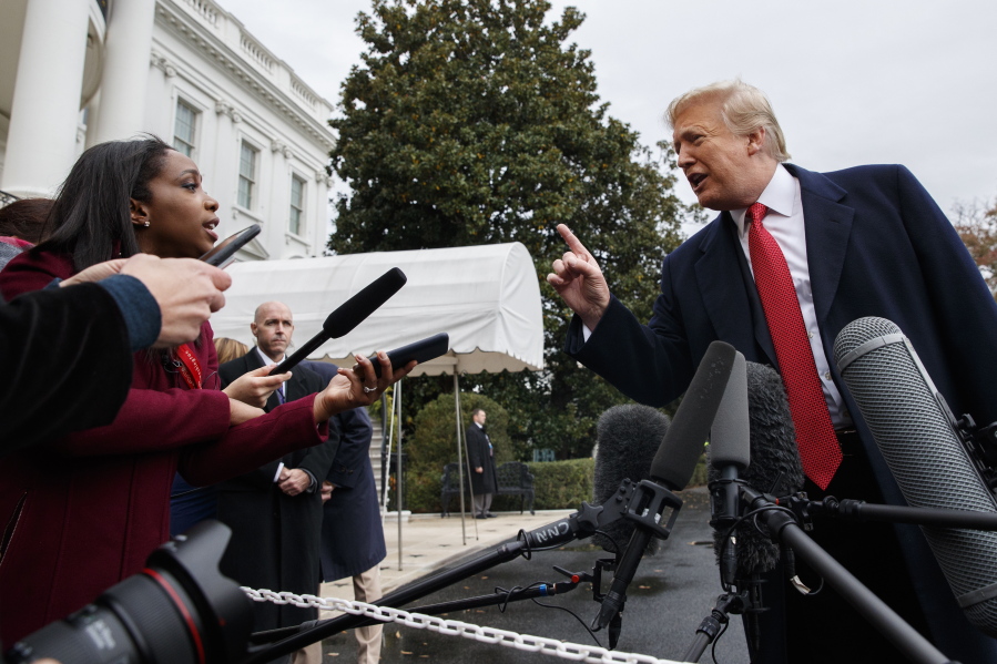 CNN journalist Abby Phillip asks President Donald Trump a question as he speaks with reporters before departing for France on the South Lawn of the White House on Friday in Washington.