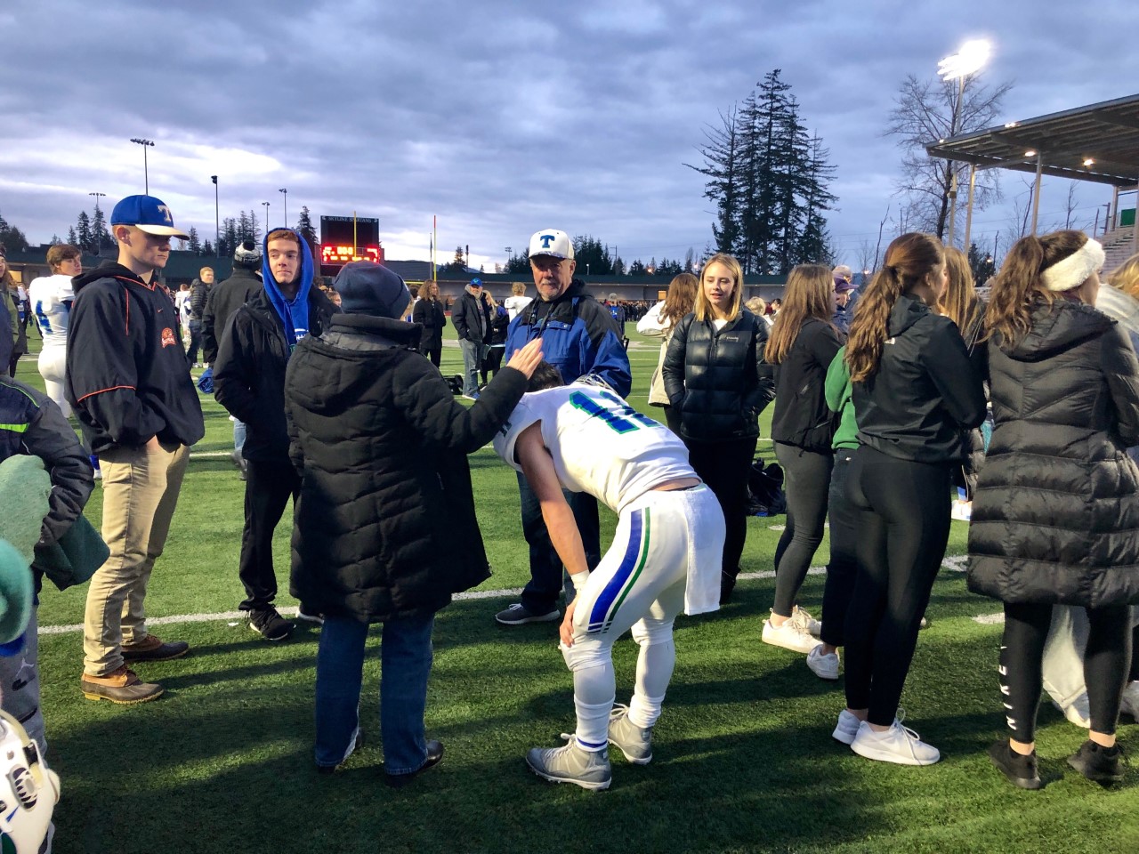 Mountain View quarterback Garrett Moen kneels over moments after a 24-7 season-ending loss to O'Dea in the 3A state semifinals at Skyline High School on Saturday, Nov. 24, 2018.
