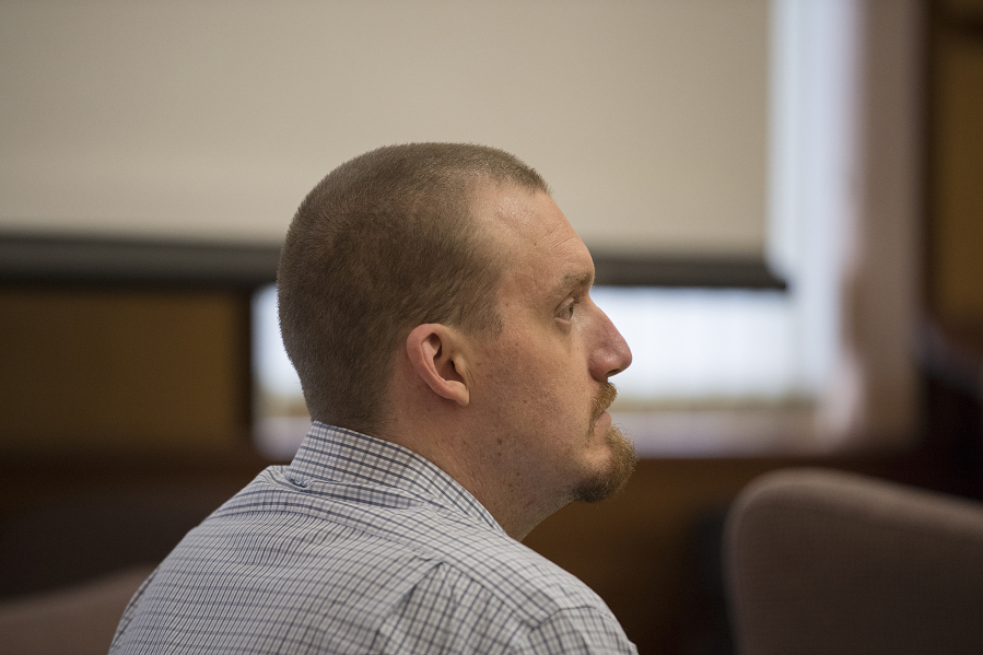 Todd Marjama listens to opening statements in his murder trial. On Tuesday, he testified that the fatal shooting of his estranged wife was accidental.