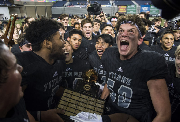 Union celebrates their win over Lake Stevens for the Class 4A state title on Saturday, Dec. 1, 2018, in Tacoma, Wash. The Titans won 52-20.