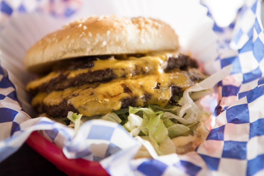 Top Burger’s Papa Burger is full of traditional toppings, and you can add bacon.
