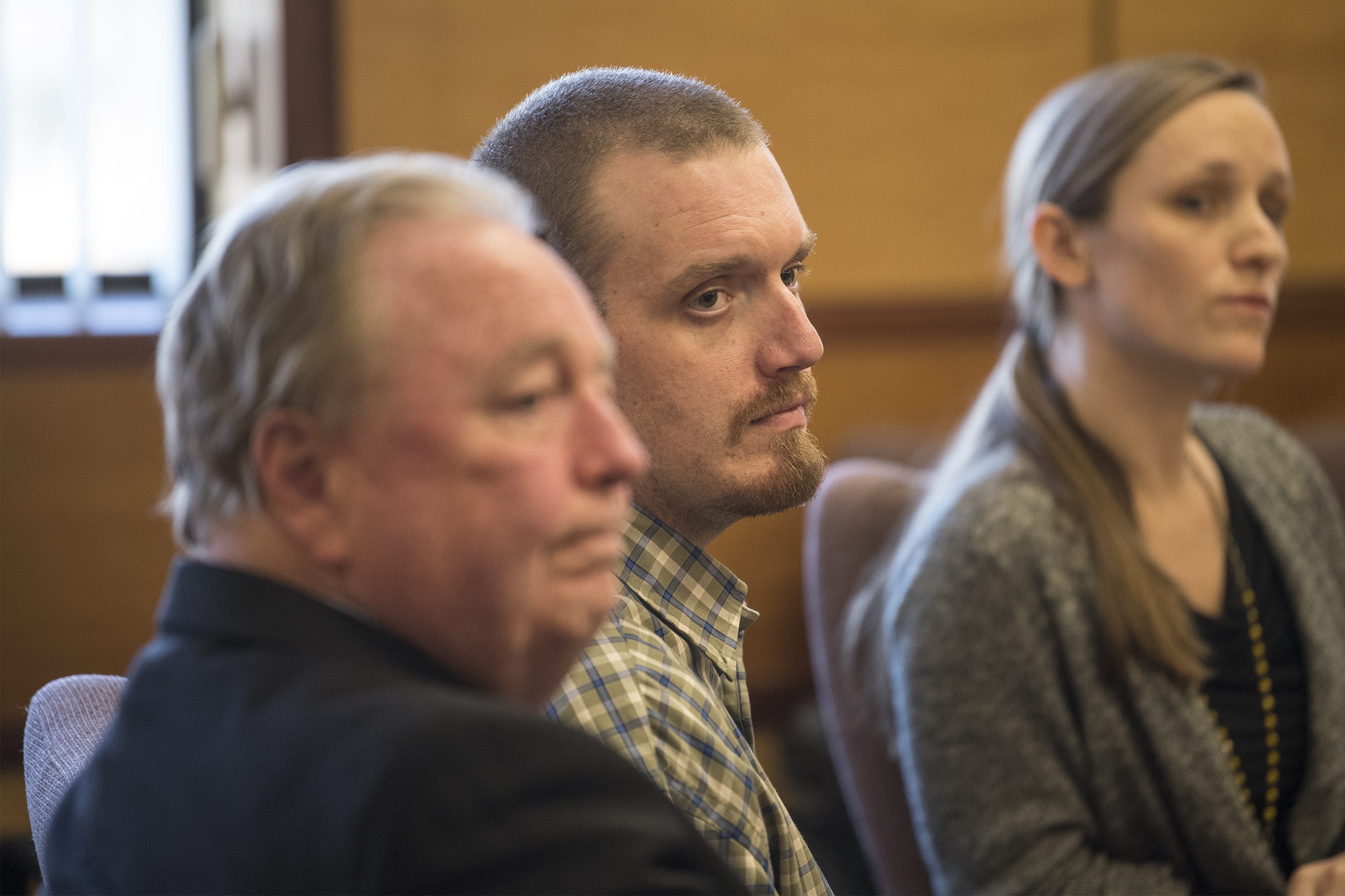 Todd Marjama Jr. listens to the jury's verdict with his attorneys in his murder trial Thursday afternoon, Dec. 6, 2018, in Clark County Superior Court. Marjama was found guilty of first-degree manslaughter and acquitted of first-degree assault.