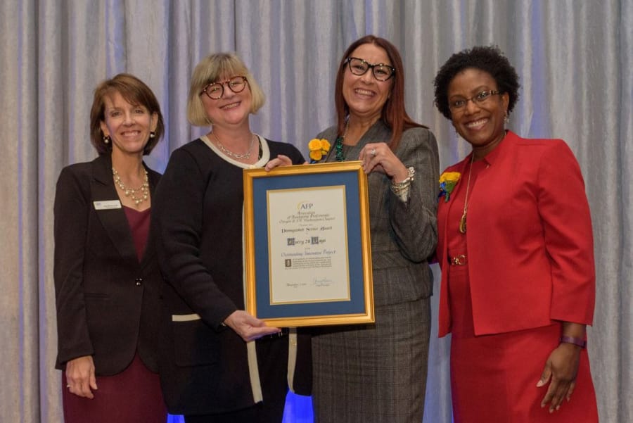 Portland: Amy Brown of Association of Fundraising Professionals, from left, Kim Hash with Share, Dianna Kretzchmar, an #Every28Days volunteer, and Kimberly Howard, who emceed the Association of Fundraising Professionals Awards, where #Every28Days earned the Outstanding Innovative Project award.