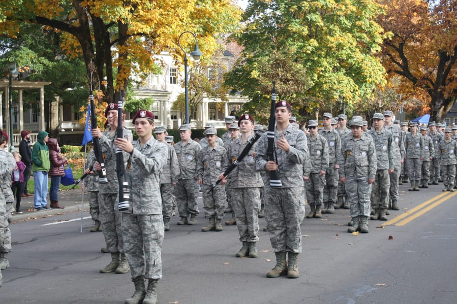 Orchards: John Snyder, Isaiah Hiebert, Dakota Sipe and Ryan Vittitoe of the Prairie High School Armed Drill Team perform at the Fort Vancouver Veterans Day parade.