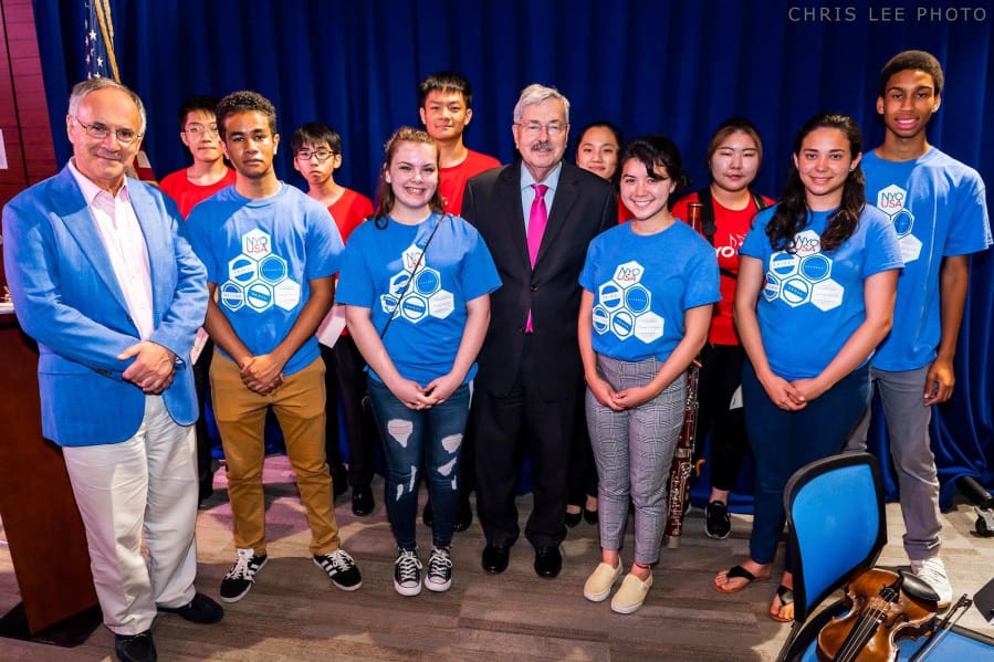 Lake Shore: Columbia River High School’s Symphony Koss, right, with U.S. Ambassador to China Terry Branstad, left, and other musicians from the National Youth Orchestra of United States on their 17-day tour of Asia.