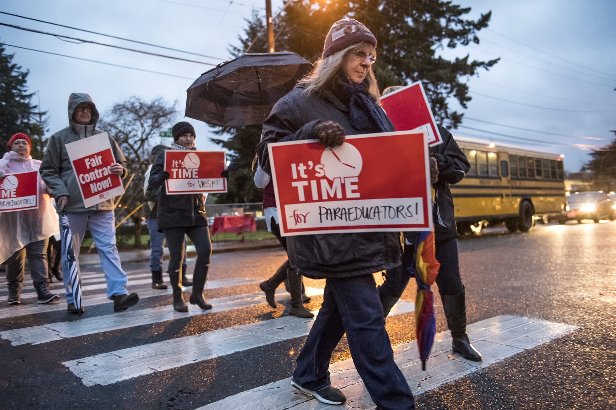 Supporters of the Vancouver Association of Education Support Professionals line the road during a rally in front of the Vancouver Public Schools' offices on Dec. 11.