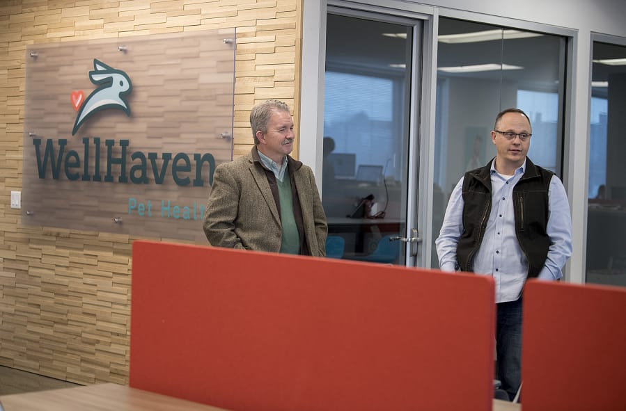 WellHaven Pet Health chief medical officer Bob Lester, left, and chief executive officer John Bork talk about the business at the company’s downtown Vancouver corporate office.