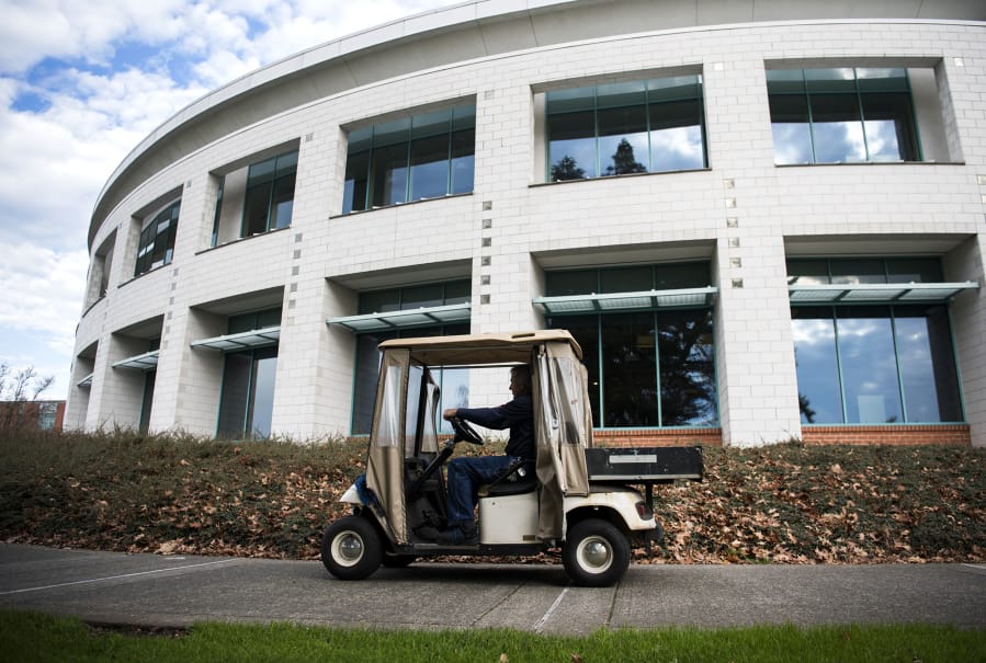 Interim custodial supervisor David Abts drives a campus golf cart to Gaiser Hall at Clark College.