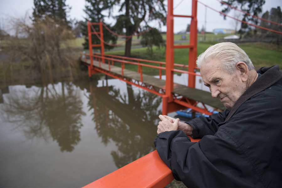 Denny Heasley catches his breath while walking down to the Golden Gate Bridge replica at his home in Ridgefield. The bridge is 110 feet long and 17 feet high. In the decade since the bridge went up, the Heasleys have received a number of visitors.