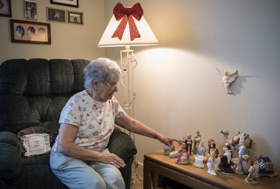Elsie Kennedy revisits her handmade Nativity set, and the miraculous story of its survival of the Columbus Day Storm of 1962, in her apartment at The Lofts at Glenwood Place in Vancouver.