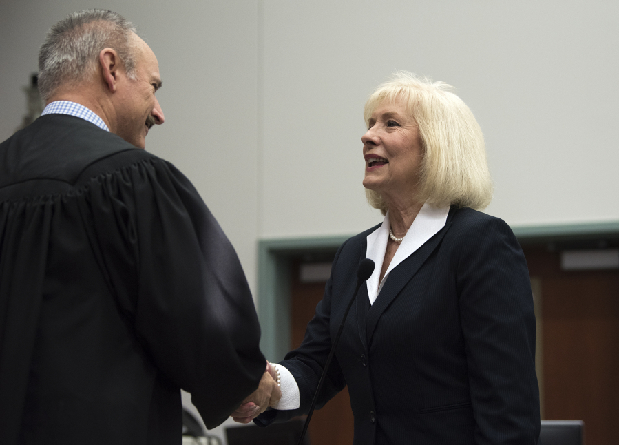 Eileen Quiring thanks Clark County District Court Judge Darvin J. Zimmerman after being sworn in Thursday as the new chair of the Clark County Council.
