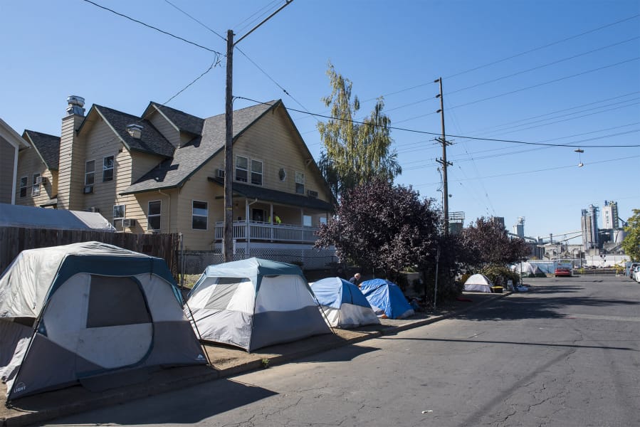 Tents and other make-shift shelters are seen here in front of Share. The new Human Service Facilities Siting ordinance will make it easier for Share to locate additional services in the future.
