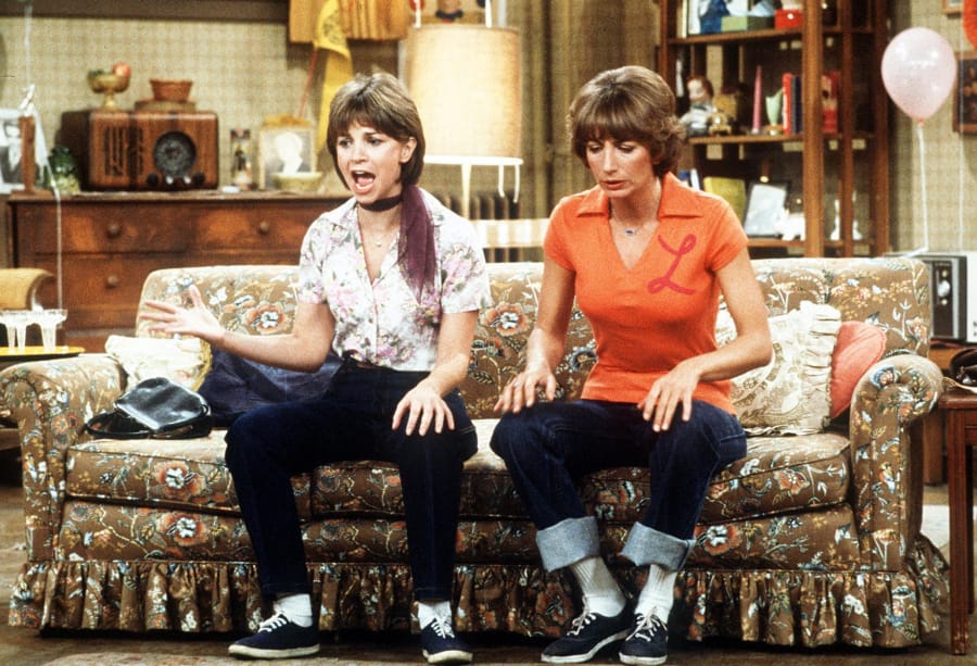 Cindy Williams, left, and Penny Marshall portray the title characters in this Dec.