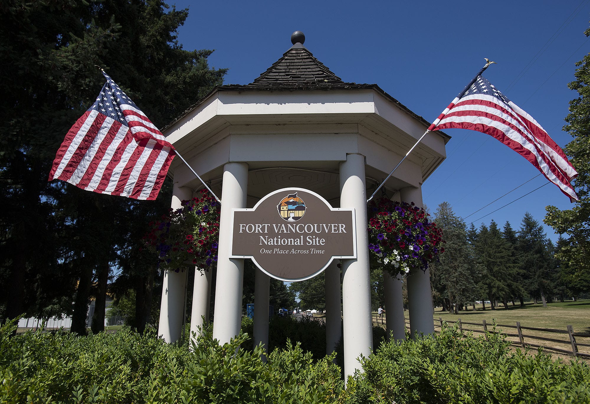 American flags fly high in July 2017 at the entrance to Fort Vancouver National Historic Site at the intersection of East Fifth Street and East Reserve Street.