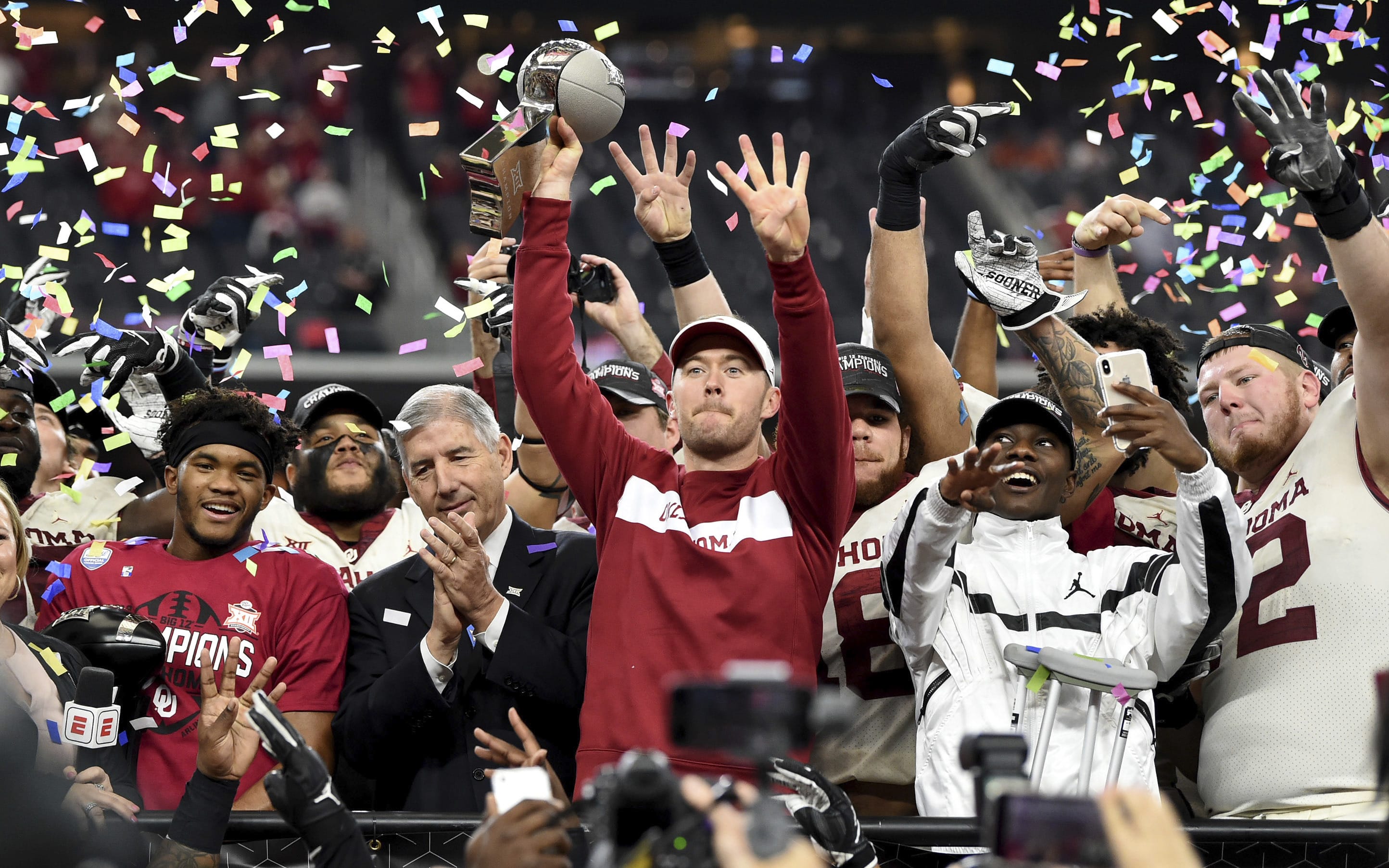 Oklahoma head coach Lincoln Riley hoists the Big 12 Conference championship trophy after beating Texas 39-27 in the Big 12 Conference championship NCAA college football game on Saturday, Dec. 1, 2018, in Arlington, Texas.