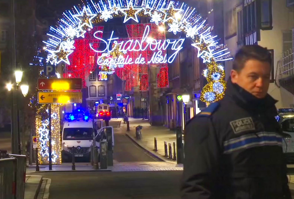 In this image made from video, emergency services arrive on the scene of a Christmas market in Strasbourg, France, Tuesday, Dec. 11, 2018. A French regional official says that a shooting in Strasbourg has left at least one dead and several wounded in the city center near a world-famous Christmas market. The prefect of France's Bas-Rhin region says the gunman, who is still at large, has been identified. Authorities haven't given a motive for the shooting.