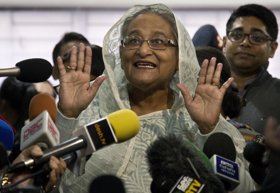 Bangladesh Prime Minister Sheikh Hasina speaks to the media after casting her vote Sunday in Dhaka.