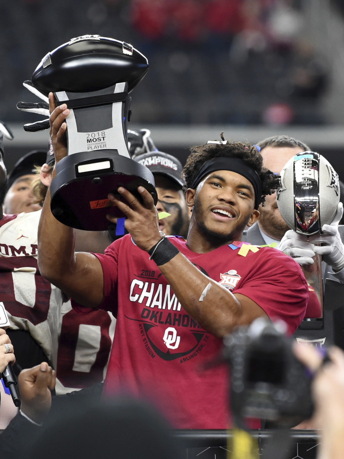 Oklahoma quarterback Kyler Murray hoists the Most Outstanding Player trophy after beating Texas 39-27 in the Big 12 Conference championship NCAA college football game on Saturday, Dec. 1, 2018, in Arlington, Texas.