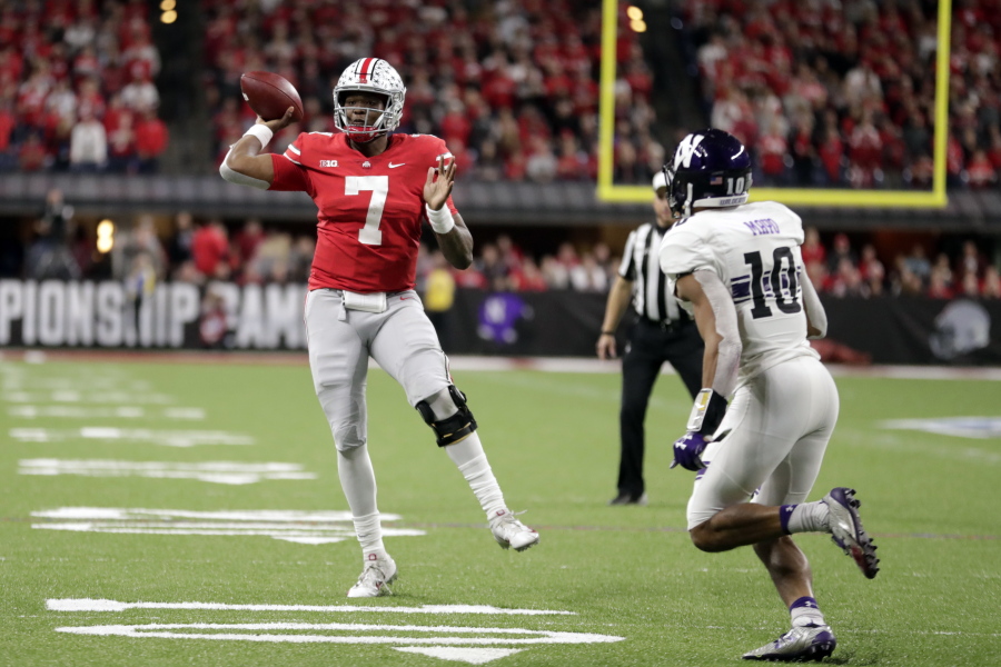 Ohio State quarterback Dwayne Haskins (7) throws as Northwestern defensive back Alonzo Mayo (10) defends during the second half of the Big Ten championship NCAA college football game, Saturday, Dec. 1, 2018, in Indianapolis.