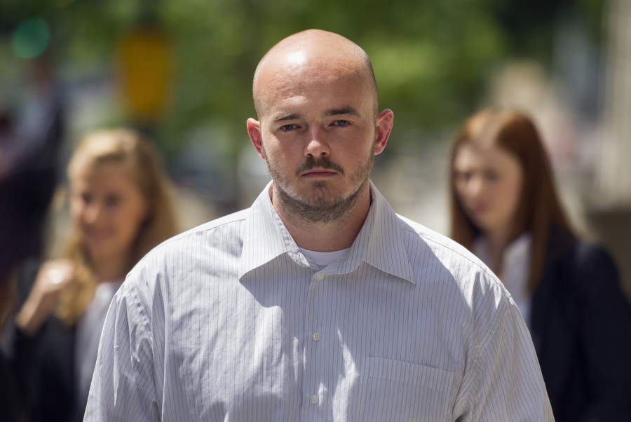 FILE - In this June 11, 2014, file photo, former Blackwater Worldwide guard Nicholas Slatten leaves federal court in Washington. Slatten has been convicted of murder at his third trial in the 2007 shooting of unarmed civilians in Iraq.