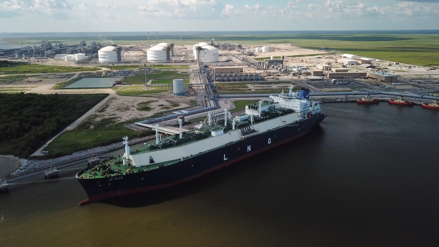 In this July 6, 2018 photo, a carrier ship for liquefied natural gas (LNG) is docked at Cheniere’Äôs Sabine Pass Terminal in Cameron Parish, La. By specifically promoting LNG exports, the U.S. government is helping guarantee the success of a handful of companies _ using taxpayer dollars to boost a nascent industry it also regulates. Houston-based Cheniere has benefited from the government’Äôs LNG push.