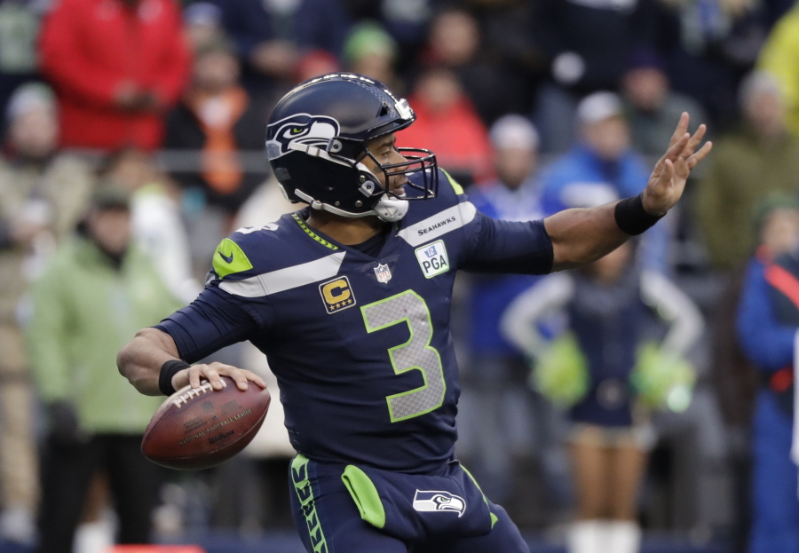 Seattle Seahawks quarterback Russell Wilson passes against the San Francisco 49ers during the second half of an NFL football game, in Seattle. Kansas City plays at Seattle on Sunday, Dec. 23.