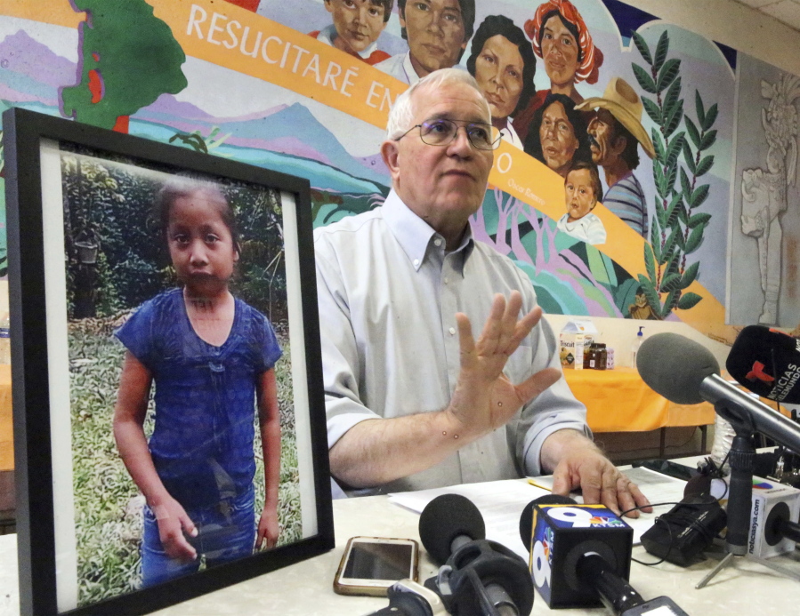 Annunciation House director Ruben Garcia answers questions after reading a statement from the family of Jakelin Caal Maquin, pictured at left, Saturday at a press briefing in El Paso, Texas.
