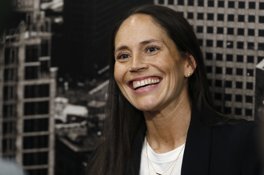 Sue Bird jokes with reporters as she talks about her new role as basketball operations assistant for the Denver Nuggets before an NBA basketball game Sunday, Dec. 16, 2018, in Denver.