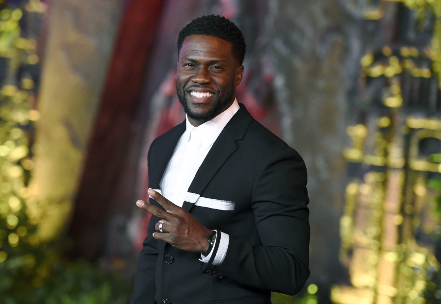 FILE - In this Dec. 11, 2017 file photo, Kevin Hart arrives at the Los Angeles premiere of “Jumanji: Welcome to the Jungle” in Los Angeles. Hart will host the 2019 Academy Awards, fulfilling a lifelong dream for the actor-comedian. Hart announced Tuesday, Dec.
