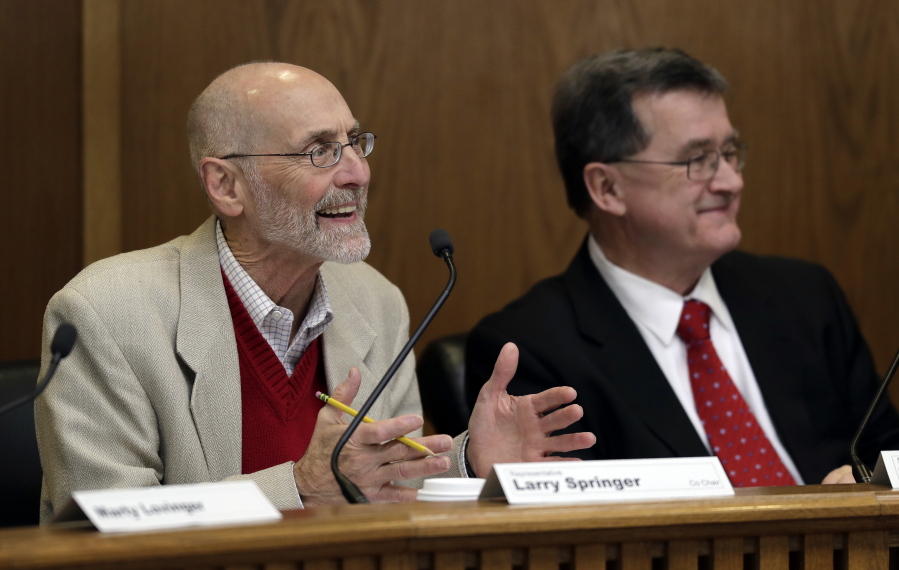 Rep. Larry Springer, D-Kirkland, left, co-chair of the Legislative Task Force on Public Records, speaks Friday, Dec. 7, 2018, as he sits next to co-chair Sen. Curtis King, R-Yakima, right, during a task force work session at the Capitol in Olympia, Wash. The panel was formed after a lawsuit produced a ruling that state legislators are subject to Washington state’s public records law. (AP Photo/Ted S.