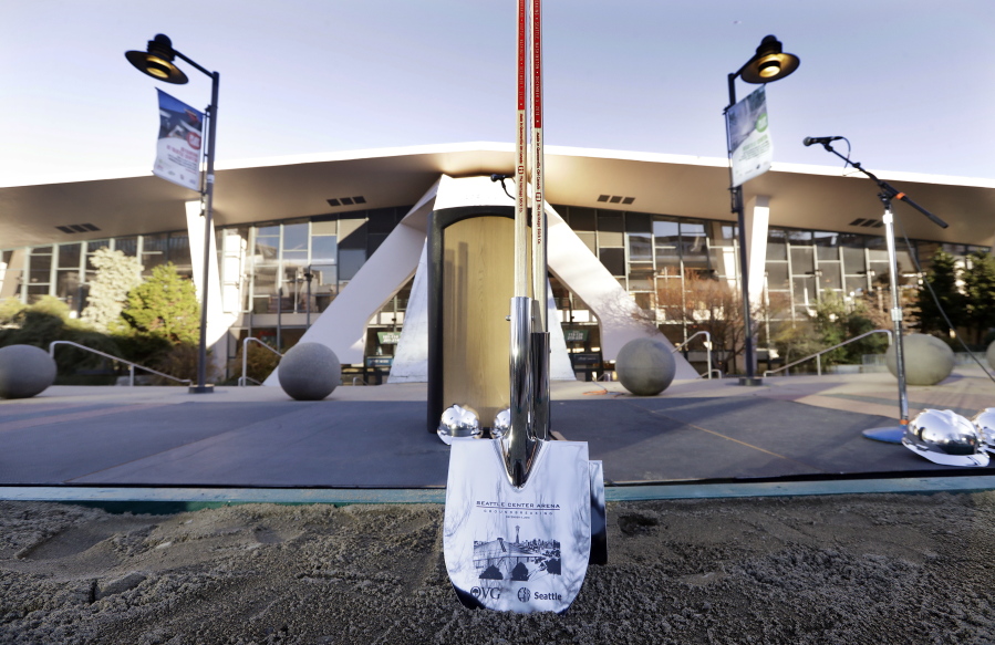 An engraved shovel stands at the ready before a ceremonial groundbreaking of a renovation of the arena at Seattle Center Wednesday, Dec. 5, 2018, in Seattle. The NHL Board of Governors gave final approval to Seattle’s bid to add the hockey league’s 32nd team a day earlier and play is expected to begin at the arena in 2021.