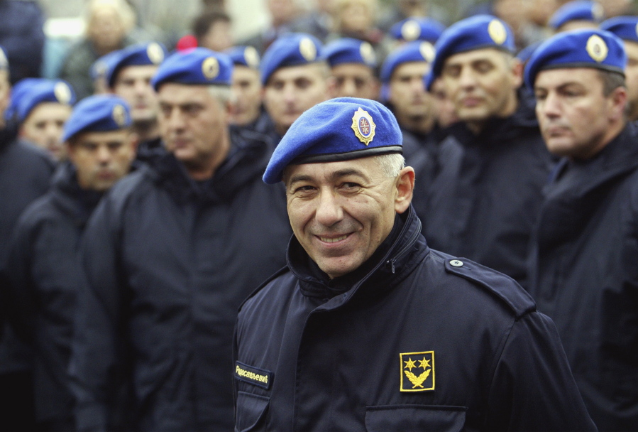 Former Serbian police commander Gen. Goran Radosavljevic known as Guri stands in front of Serbia’s elite police troops during a protest in Belgrade, Serbia. In a statement Wednesday Dec. 19, 2018, the U.S. State Department linked former Serbian police commander Goran Radosavljevic to the 1999 murder of three Albanian-American brothers and banned him and his family members from entering the United States.