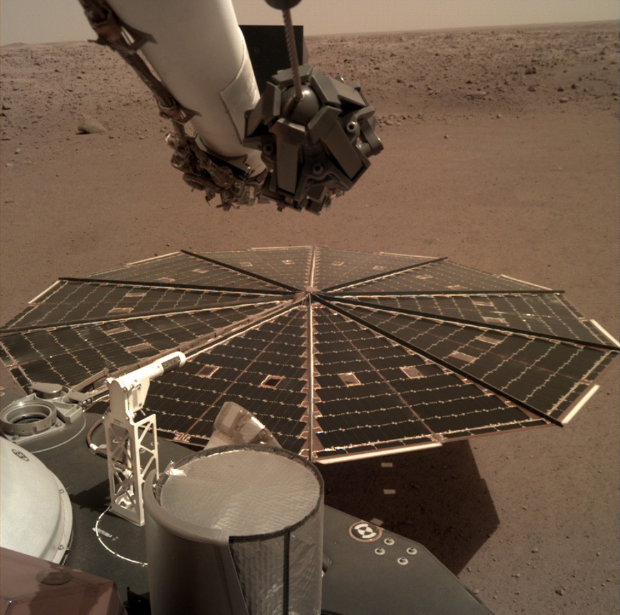 This Friday, Dec. 7, 2018 photo made available by NASA shows a view from the arm-mounted camera on the InSight Mars lander. The spacecraft arrived on the planet on Nov. 26.