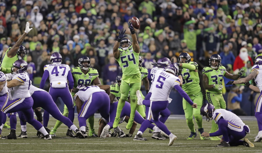 Seattle Seahawks’ Bobby Wagner (54) leaps to block a field goal attempt by Minnesota Vikings’ Dan Bailey in the second half of an NFL football game, Monday, Dec. 10, 2018, in Seattle.