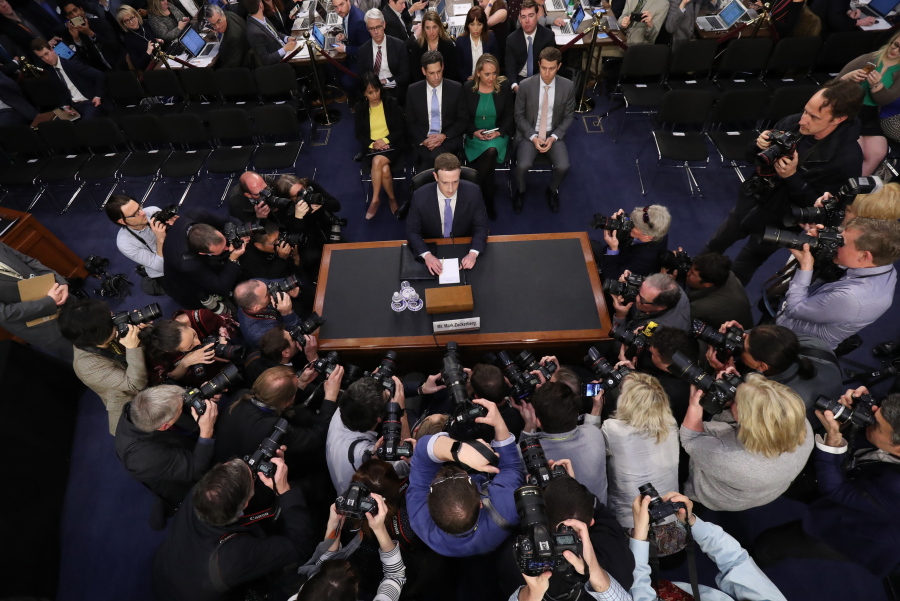 FILE - In this April 10, 2018, file photo, Facebook CEO Mark Zuckerberg arrives to testify before a joint hearing of the Commerce and Judiciary Committees on Capitol Hill in Washington, about the use of Facebook data to target American voters in the 2016 election. We may remember 2018 as the year in which technology’s dystopian potential became clear, from Facebook’s role enabling the harvesting of our personal data for election interference to a seemingly unending series of revelations about the dark side of Silicon Valley’s connect-everything ethos.