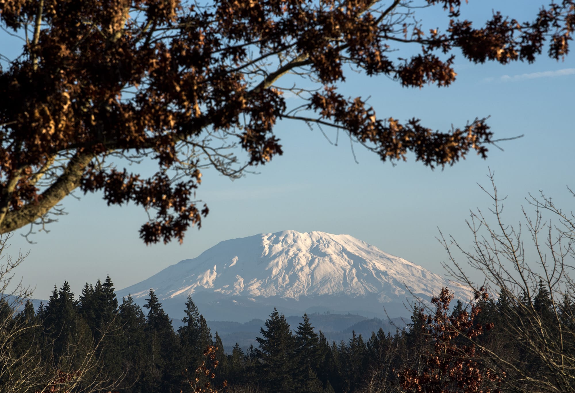 A fresh blanket of snow is visible on Mount St. Helens from the Washington State University Vancouver campus on Dec. 6, 2018. Seasonal temperatures in the upper 40s and lows in the upper 30s to low 40s are expected throughout the weekend.