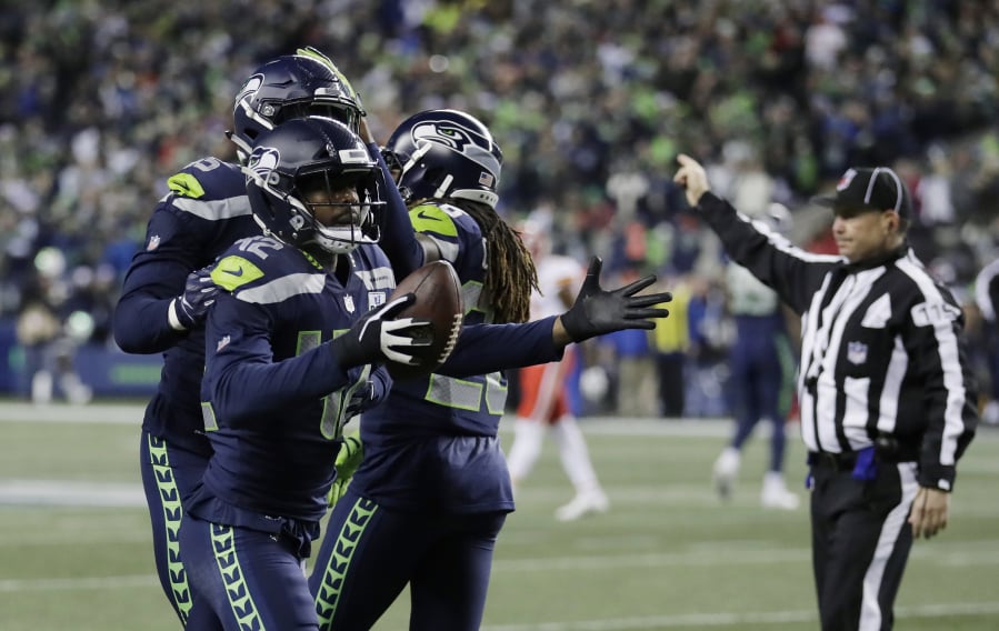 Seattle Seahawks defensive back Delano Hill (42) reacts after he recovered a fumble during the first half of an NFL football game against the Kansas City Chiefs, Sunday, Dec. 23, 2018, in Seattle.