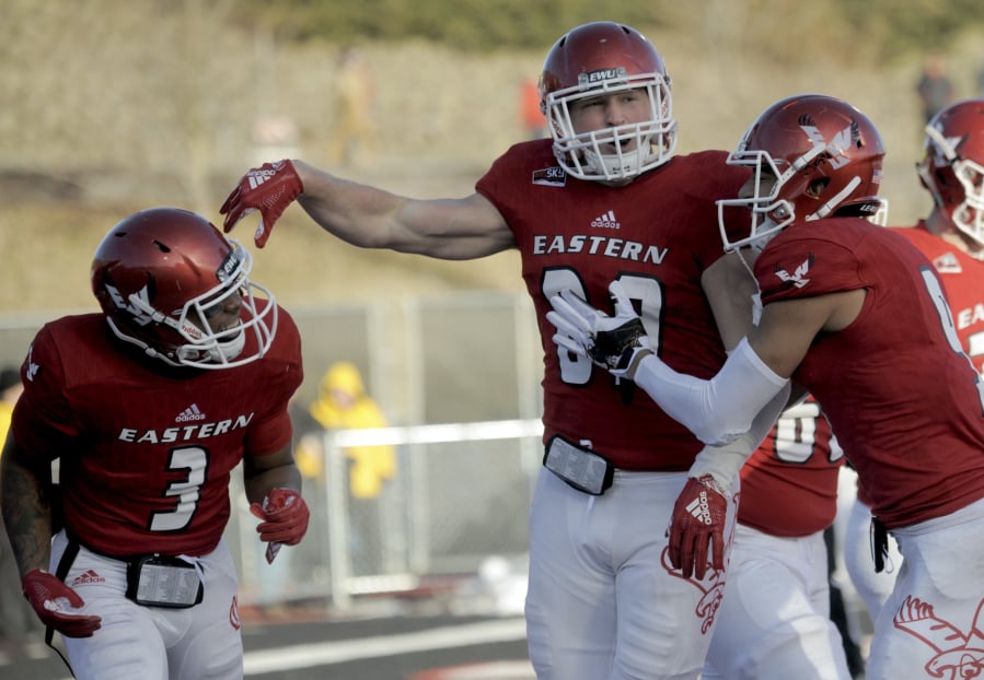 Eastern Washington quarterback Eric Barriere (3) celebrates a touchdown with Jayce Gilder (89) during the second half of an NCAA college football game against Maine, Saturday, Dec. 15, 2018, at Roos Field in Cheney, Wash.
