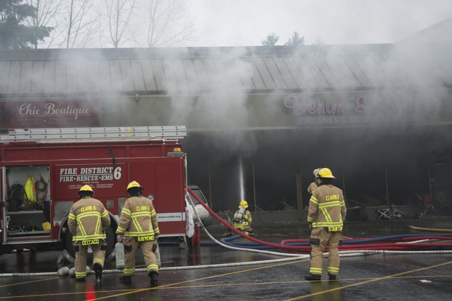 Firefighters from Fire District 6, Vancouver Fire Department and Clark County Fire and Rescue responded to a three-alarm fire at Holly Park Shopping Center in Hazel Dell. Recent training helped firefighters save the building, Fire District 6 officials say.
