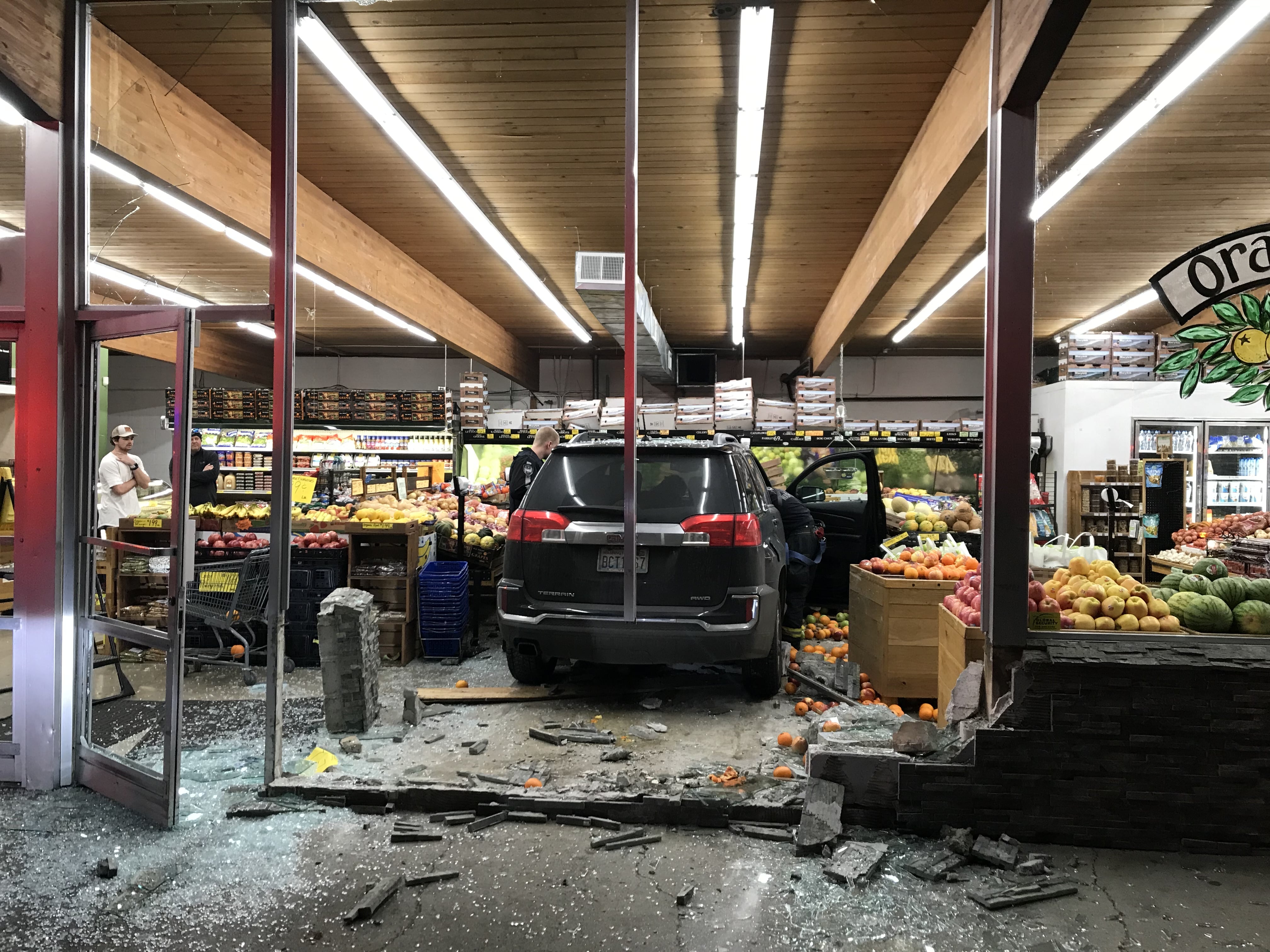 An SUV sits stopped amid what was part of Camas Produce's fruit selection after its driver, whom the Camas Police Department says was driving while impaired, smashed through the front of the store Thursday evening. No one was injured.